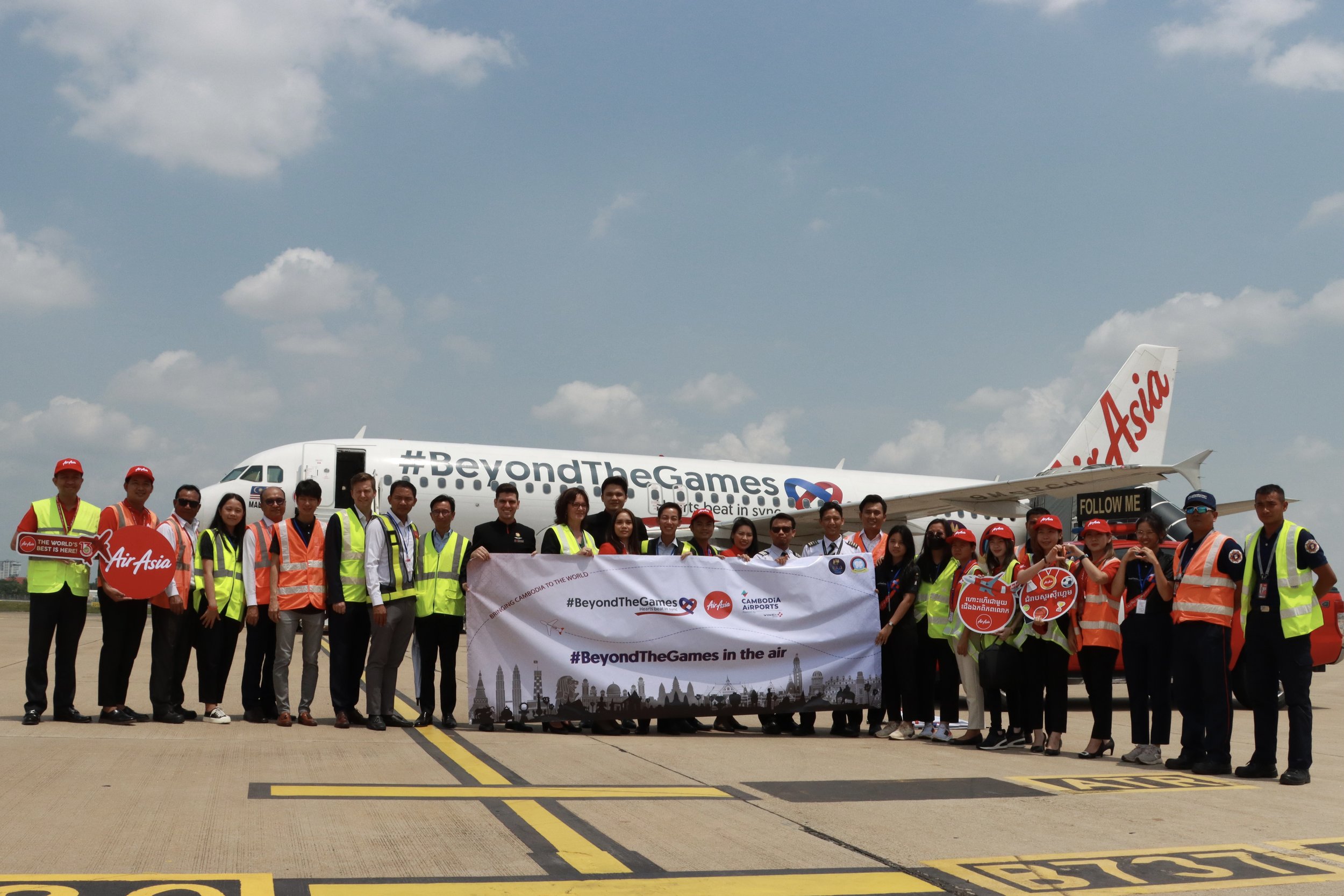 Photo Caption: Representatives of AirAsia and the Union of Youth Federations of Cambodia (UYFC) at the unveiling of AirAsia #BeyondTheGames Livery at Phnom Penh International Airport today.