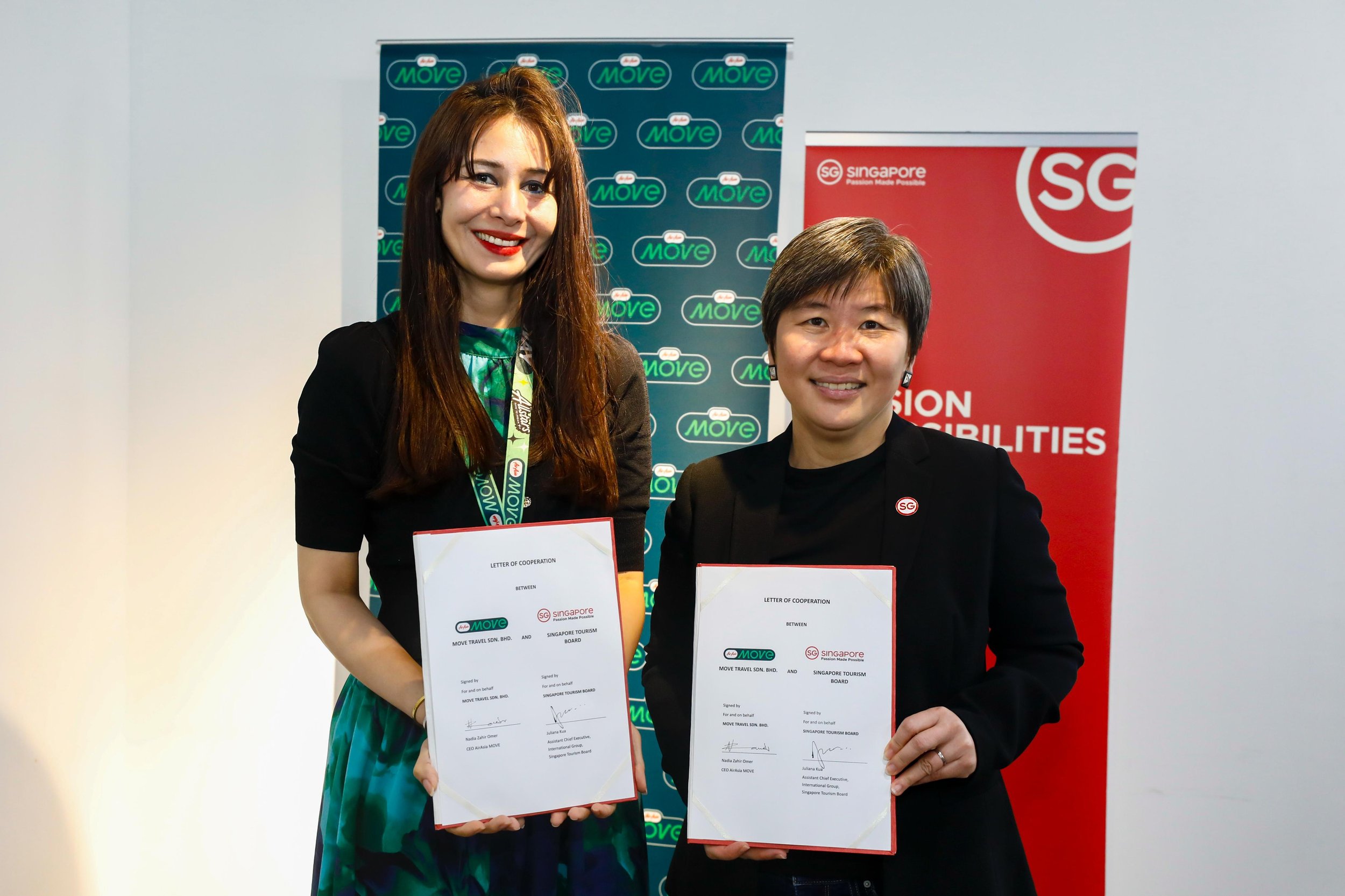  Photo caption: (From left) Nadia Omer, CEO of AirAsia MOVE, and Juliana Kua, Assistant Chief Executive (International Group) of the Singapore Tourism Board, celebrating the new partnership to boost regional tourism. 