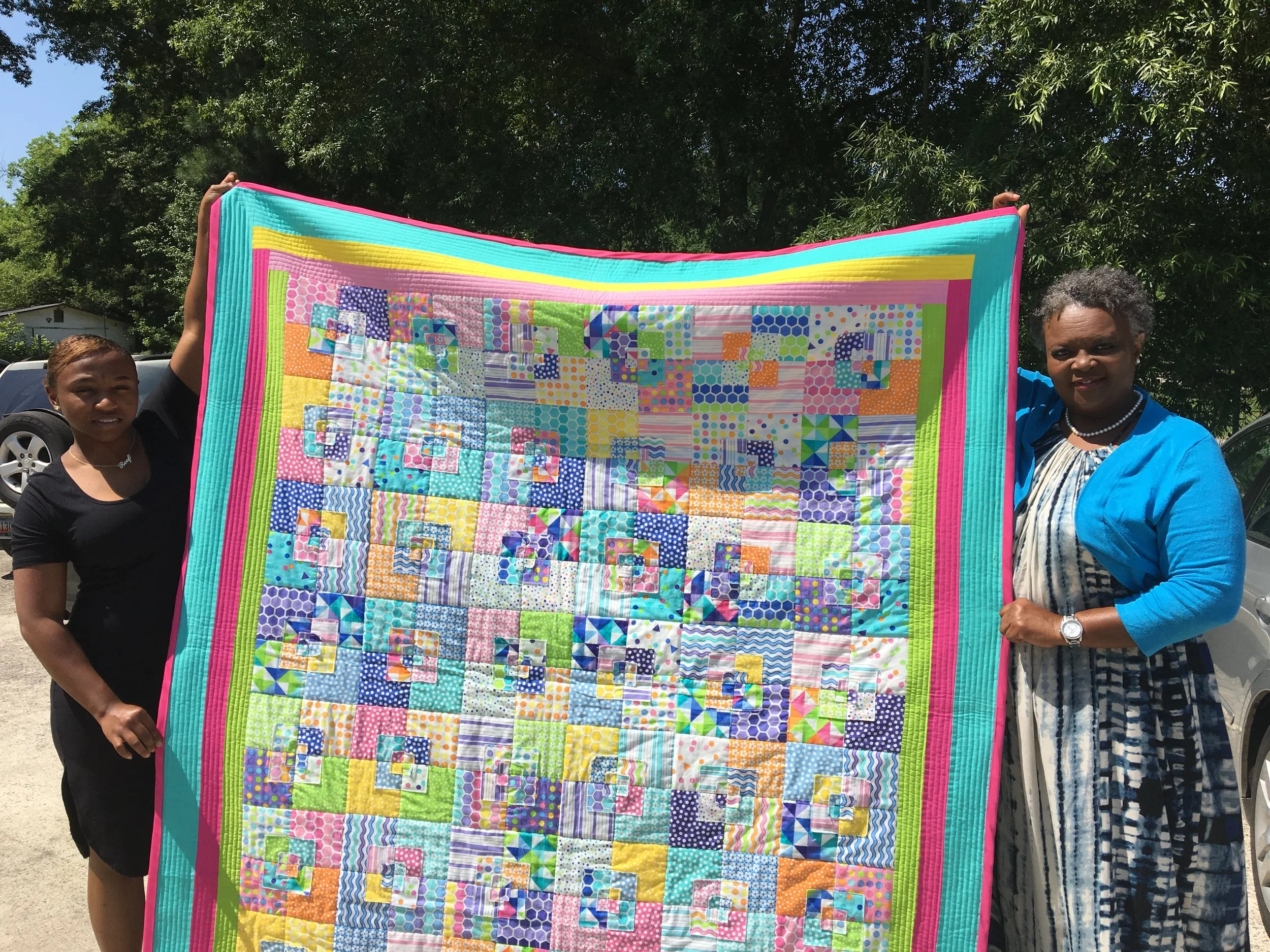 Want a quilt woven with 'cupcakes and confetti'? She's giving hers away.