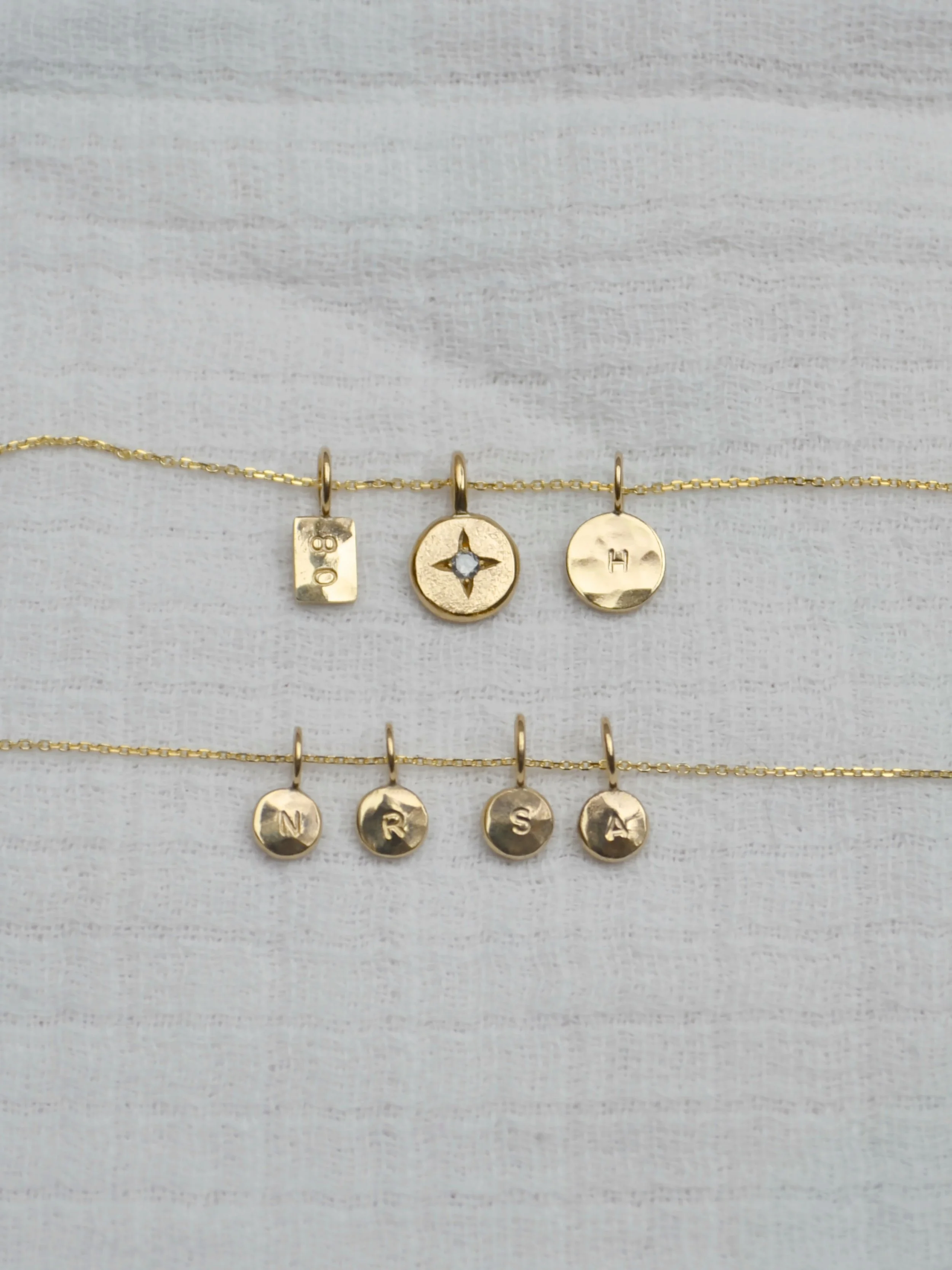 Tiny 9ct gold pendants ~ quiet little pieces with a personal mark ~ simple, soft, and made to be worn every day ✨

#personalisedjewelleryuk #glasgowjeweller