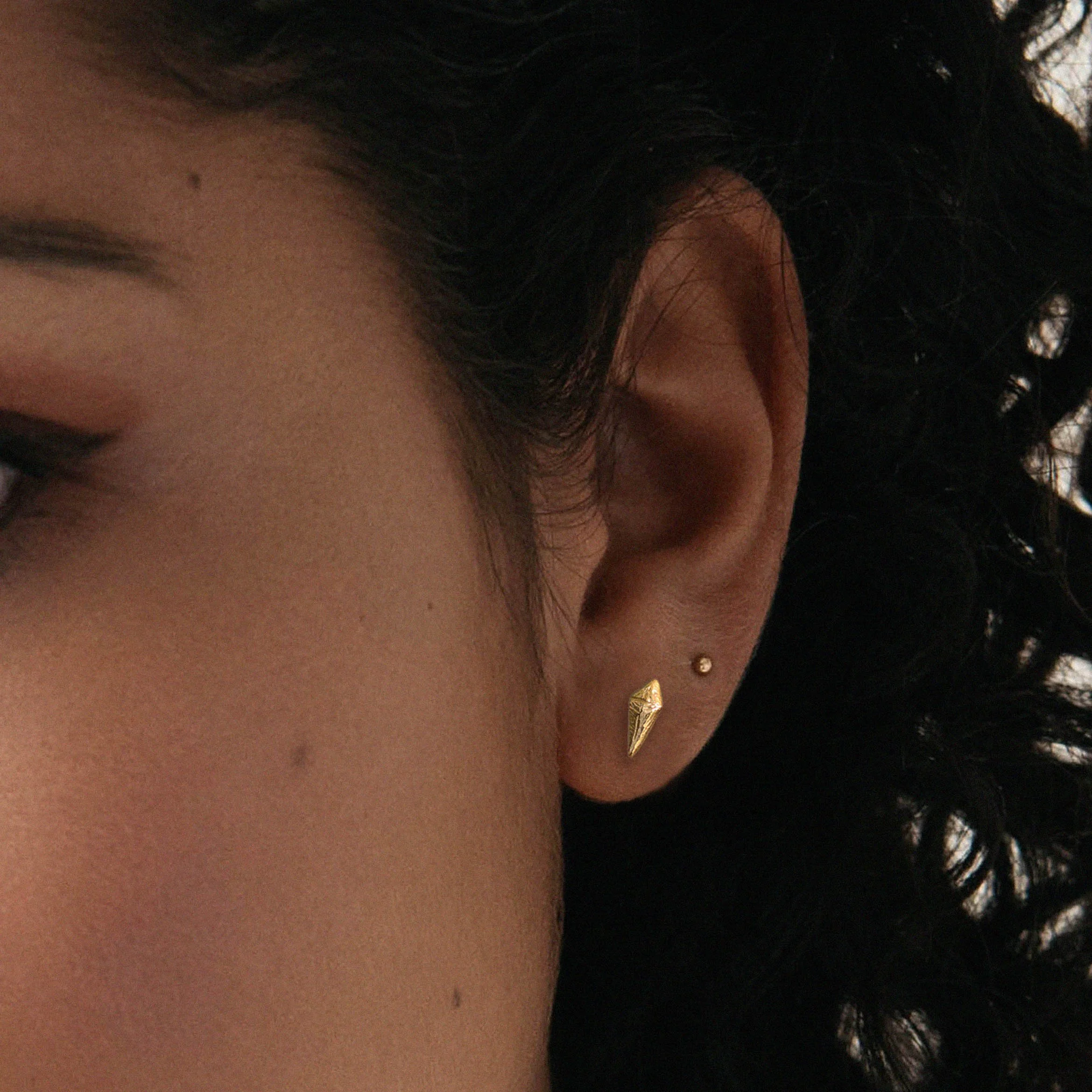 gold organic kite stuff shown close up on a model