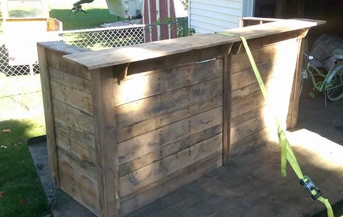 Handmade Bar, made from rustic wood by Kirt Peterson. He started making home decor and furniture out of pallets a few years ago, and now made and amazing piece for us. He works on his relative's dairy farm and is passionate about agriculture which is why he wanted to donate to Dairy Discovery.