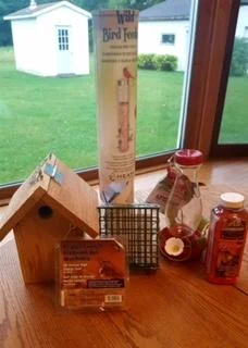 Made by Henry Kamp, Wren House, and birdseed, hummingbird feeder and feed from Clarksville Feed.
