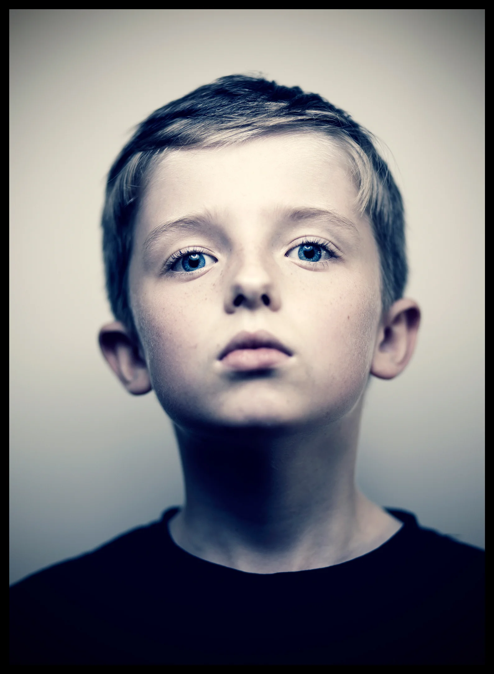 cool portrait of a blue eyed boy