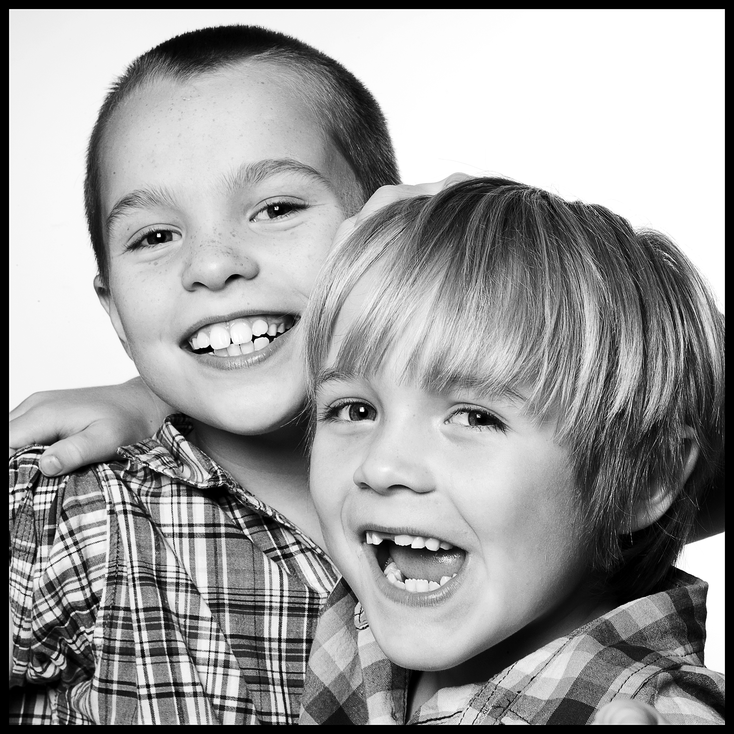 smiling portrait of two young brothers