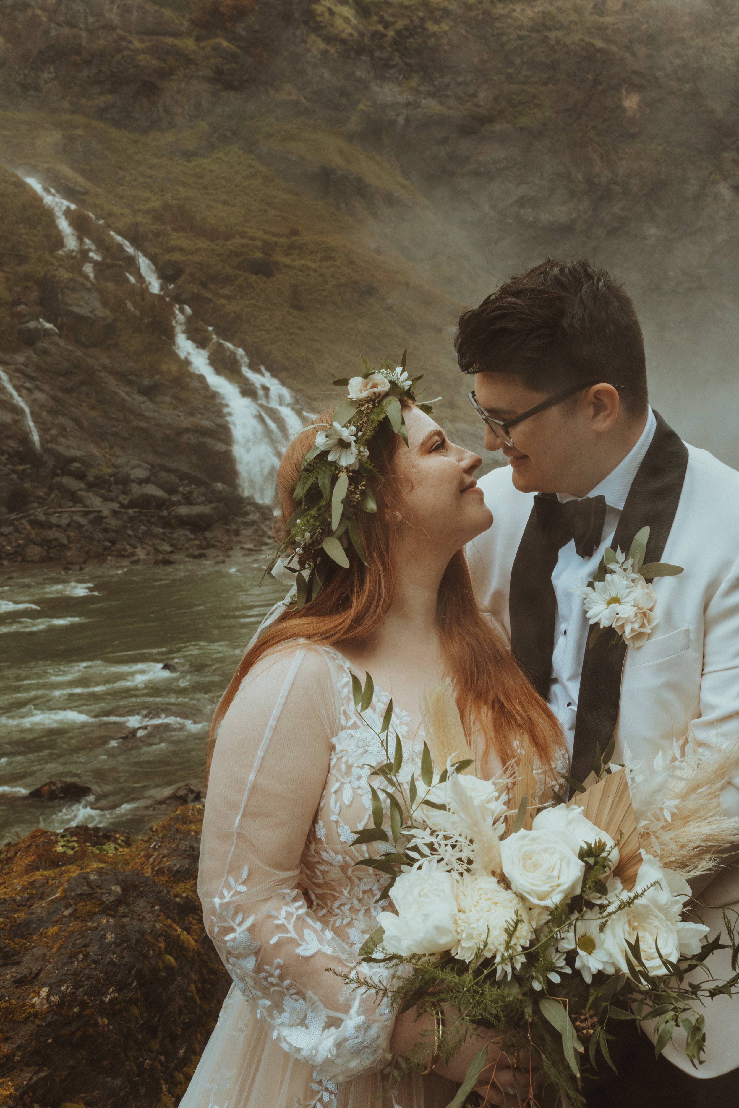 Bride And Groom Pose in front of Snoqualmie Falls