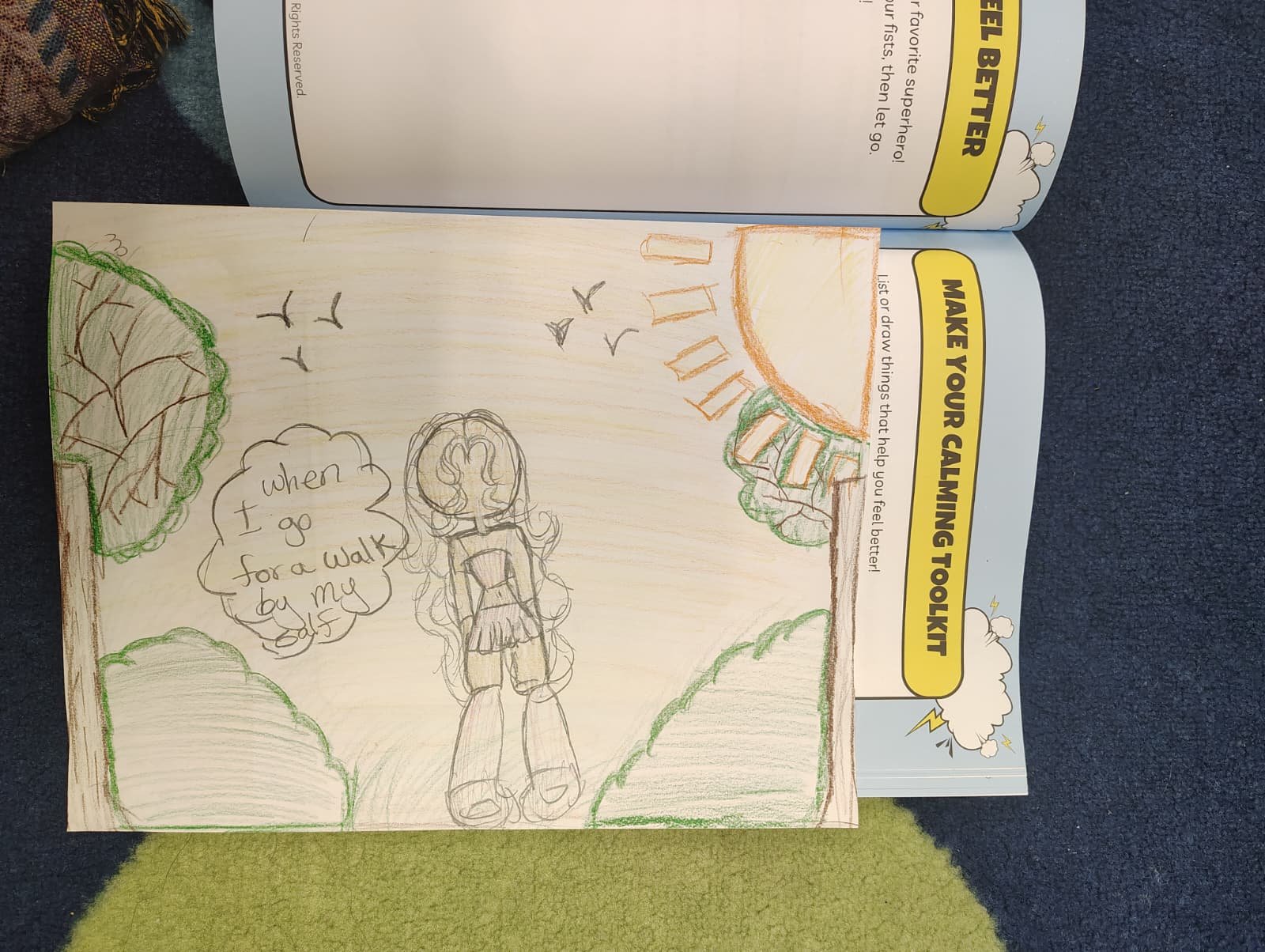 Colored pencil drawing of a girl walking in nature with a speech bubble that says 'when I go for a walk by myself'. The scene includes trees, birds, a sunset or sunrise, and clouds.
