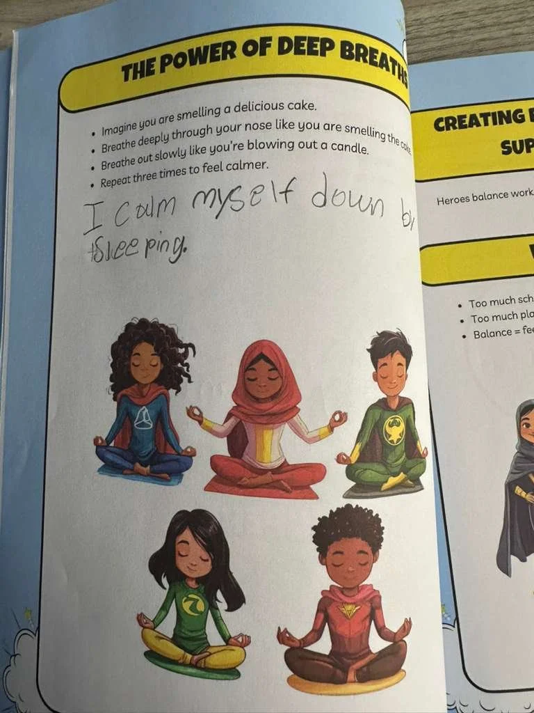 Illustration of five diverse children sitting cross-legged in meditation poses, each wearing a superhero costume and expressing calmness.