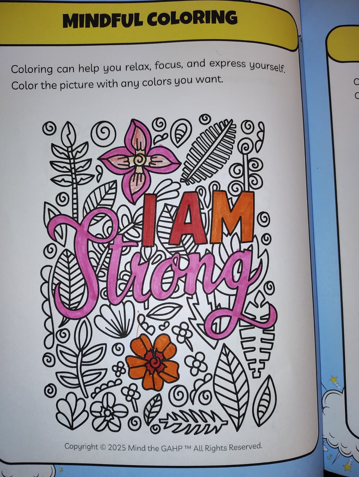 Black and white coloring page with floral and leaf patterns, and the words 'I AM Strong' written in colorful letters, including pink, red, and orange.