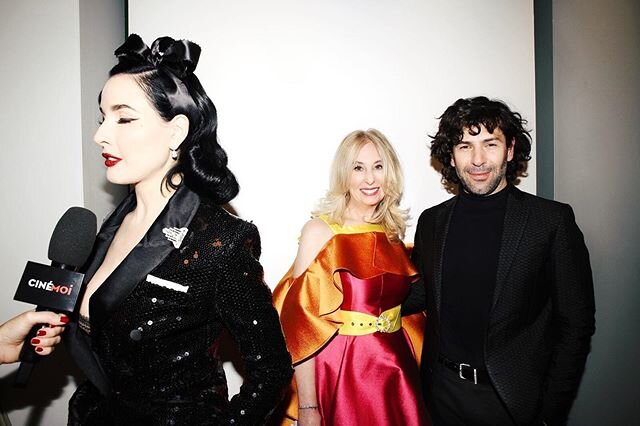One of my favorite moments ever from #PFW is when @Alexismabille did a little styling by adjusting the belt on my #alexismabille dress before the photographers backstage took our photo. That is @ditavonteese, who walked in his show, being interviewed