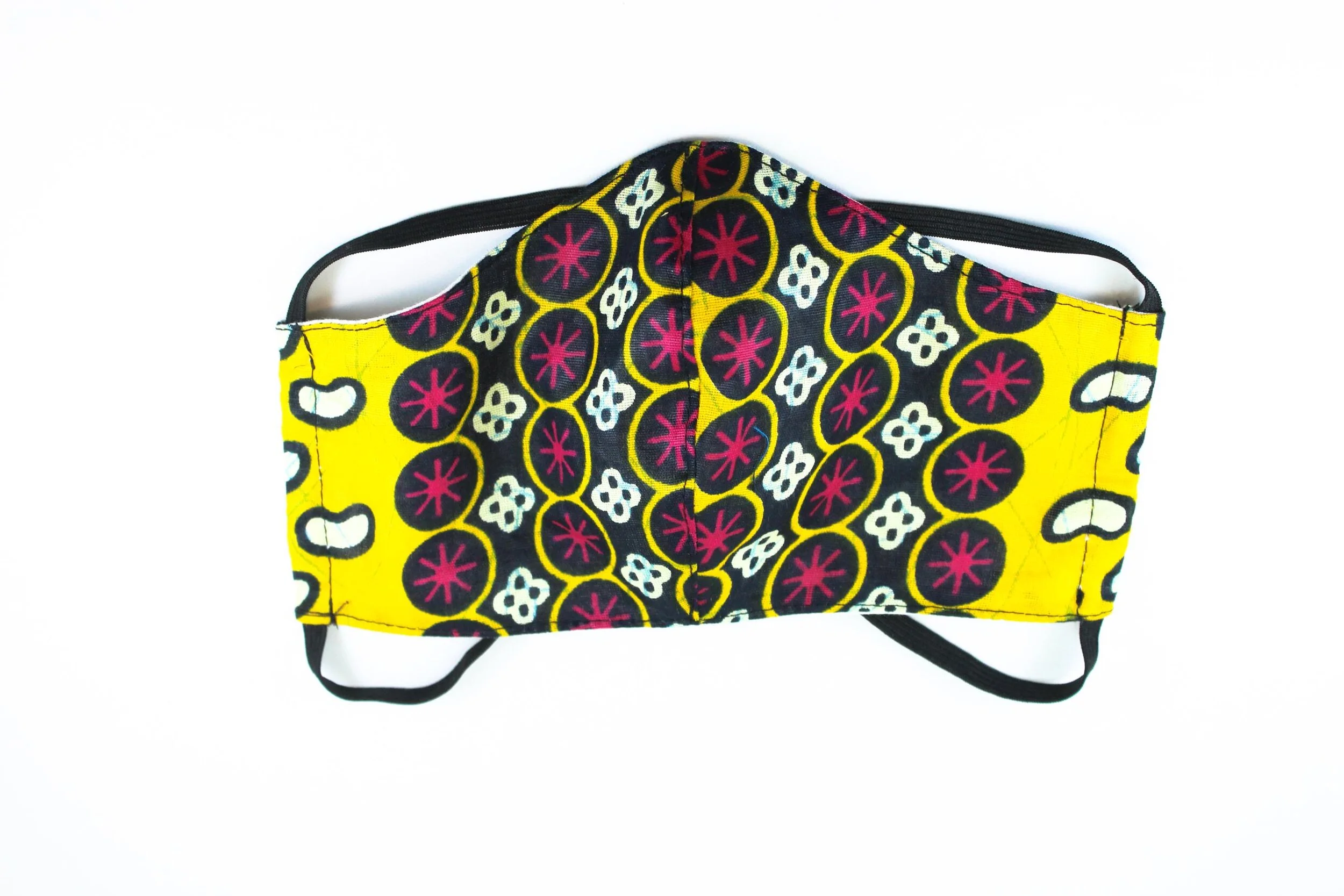 A yellow face mask with red and white emblems