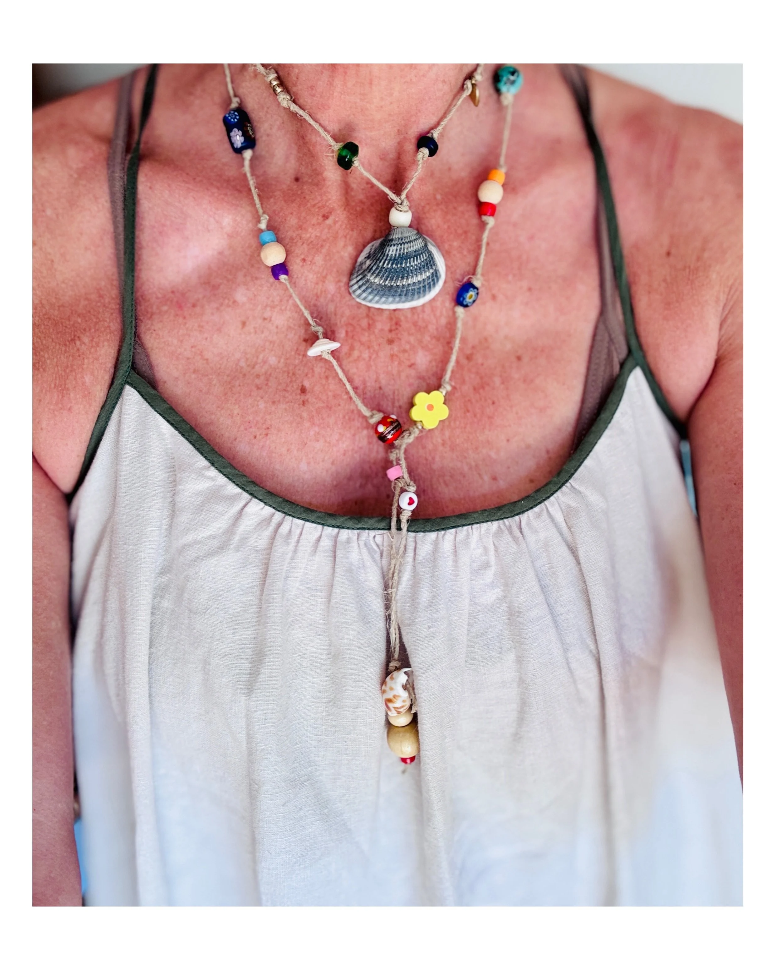 A weathered gray Atlantic found shell 🐚 surrounded by turquoise 🩵, other found shells 🫶🏼🌞, blossom 🌼 , glass African beads, a heart ❣️, plus the word OM 🙏 hidden within&hellip;.this piece is called,

ATLANTIC OM 🌊☀️
 

&hellip;and my summer e