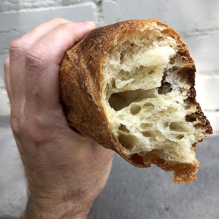  And now the sad part: In order to enjoy this baguette, you’re going to have to tear into it. It’s ok. They’re made to be torn into. See how crunchy and splintery the outside is, and how soft, moist, and almost creamy the inside is? Now THAT’S a baguette. 