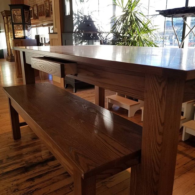 This ash table and bench are sitting pretty in our showroom, waiting to go home for the holidays! 🎅🤶 We think the apron drawer is pretty slick too!
.
.
.
Homestead Cabinetmakers 
Custom Furniture &amp; Cabinetry made in downtown Kalamazoo, Michigan