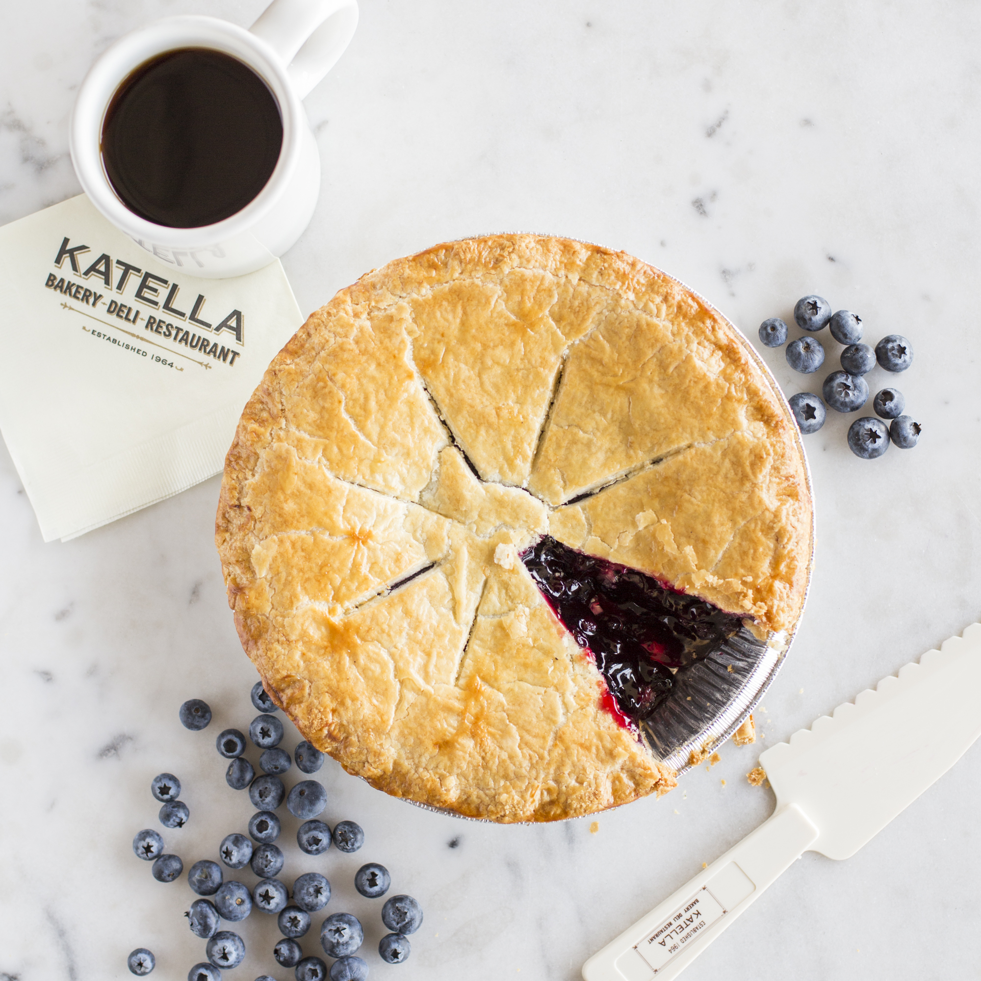 Katella Bakery blueberry pie and a cup of coffee