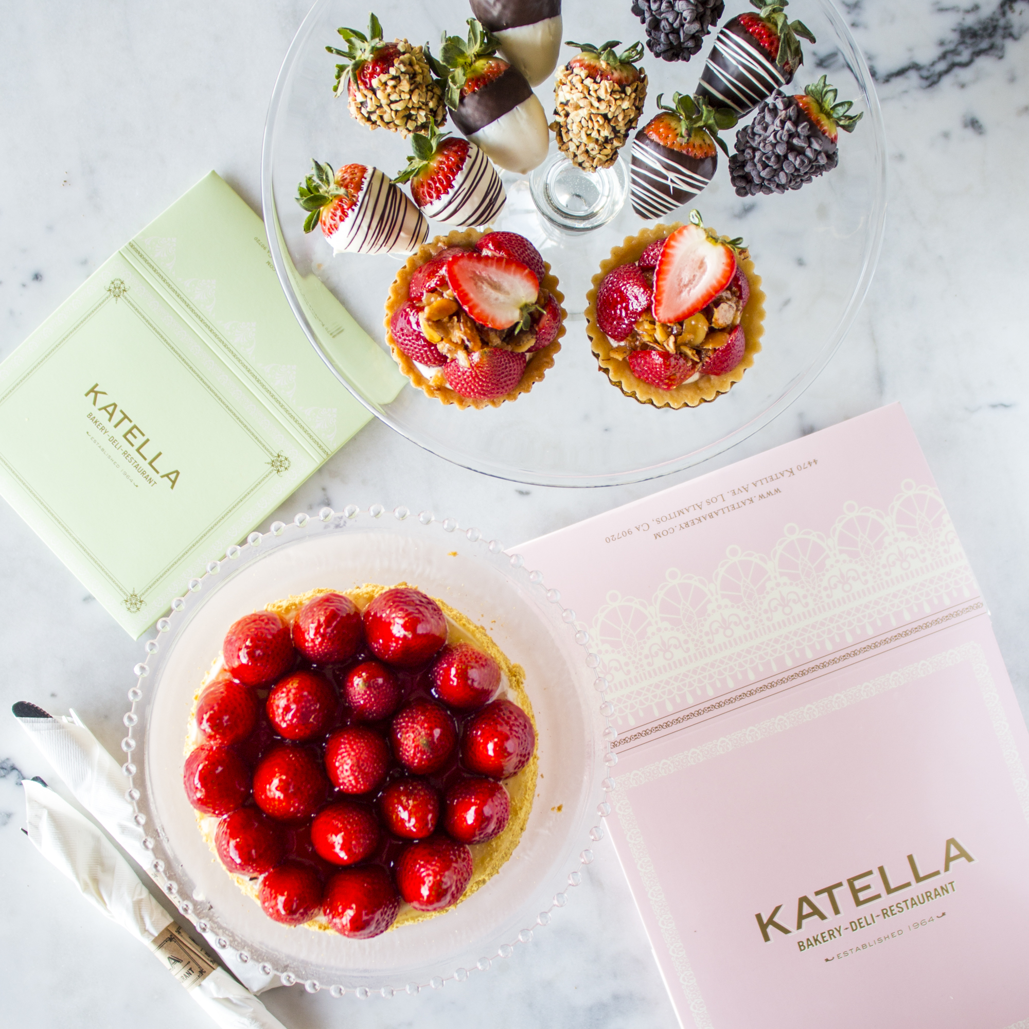 Katella Bakery display of specialty desserts highlighting fresh strawberries