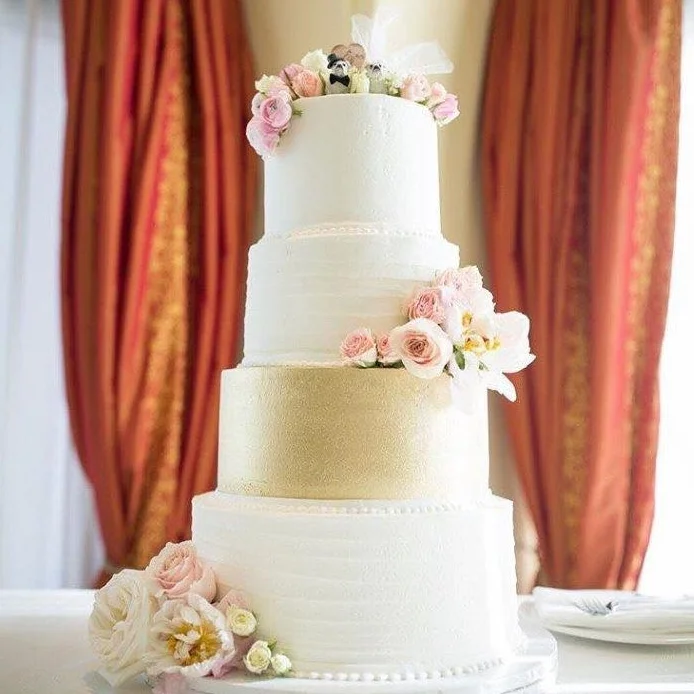 Katella Bakery four tear wedding cake with real flower arraignments