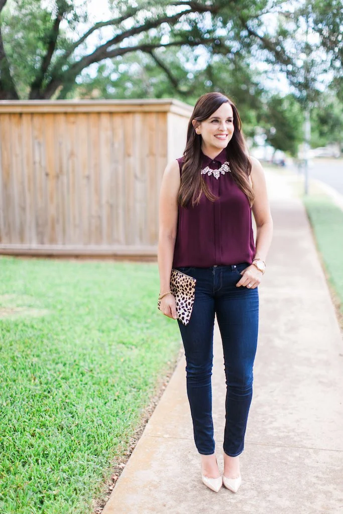 burgundy top with blue jeans