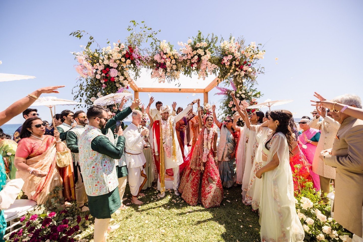 The smiles on the newlyweds as they are surrounded by all that love heading back down the aisle as husband and wife #PartnersinParadise⁠
🇲🇽 @shaadidestinations⁠
🧚 @jccastilloweddings⁠
🎥 @onesocietyfilms keeksqueeks @mrfuji⁠
🧑🏻&zwj;💻 @baower_ra