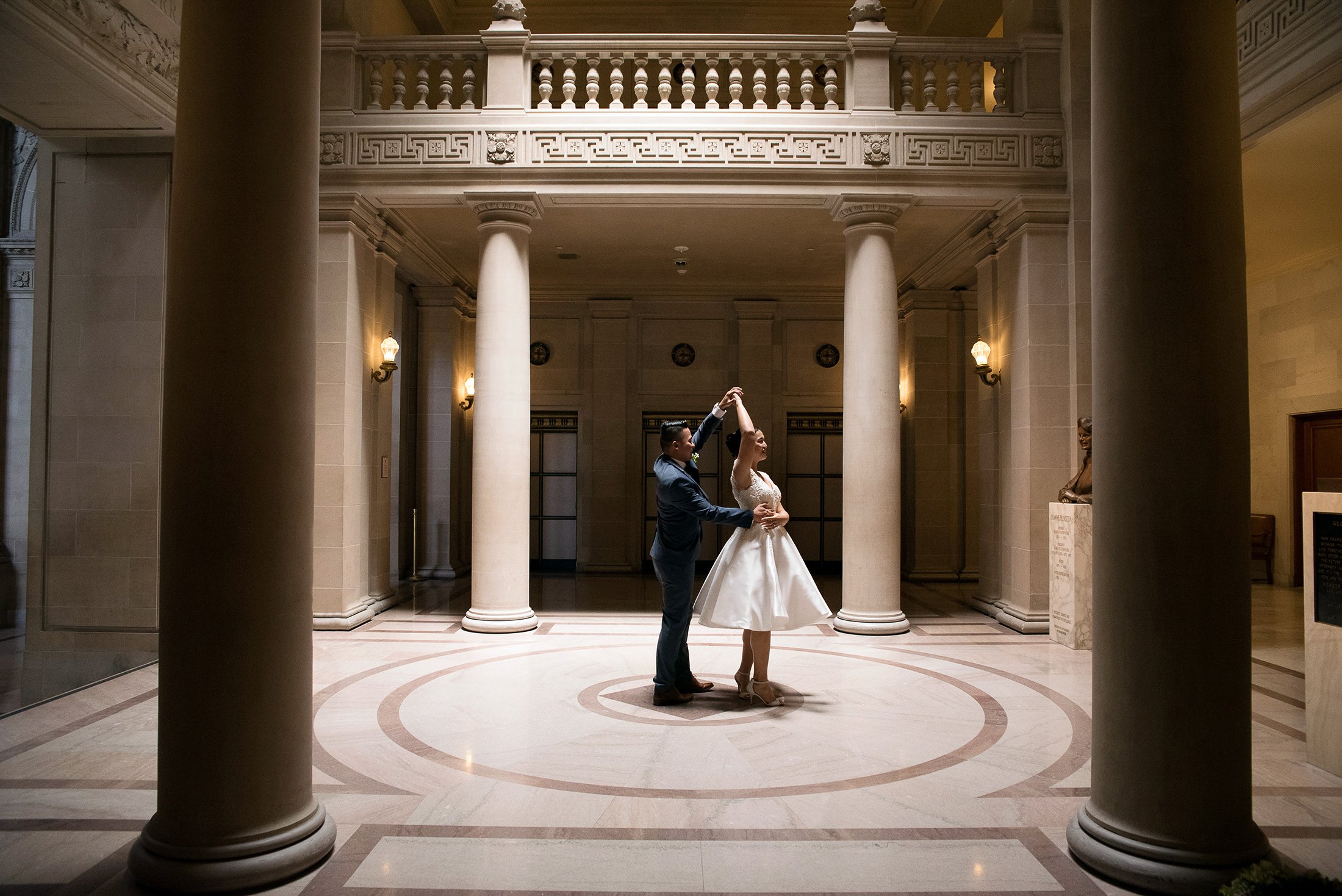  Bride and groom dancing in the rotunda at San Francisco City Hall 