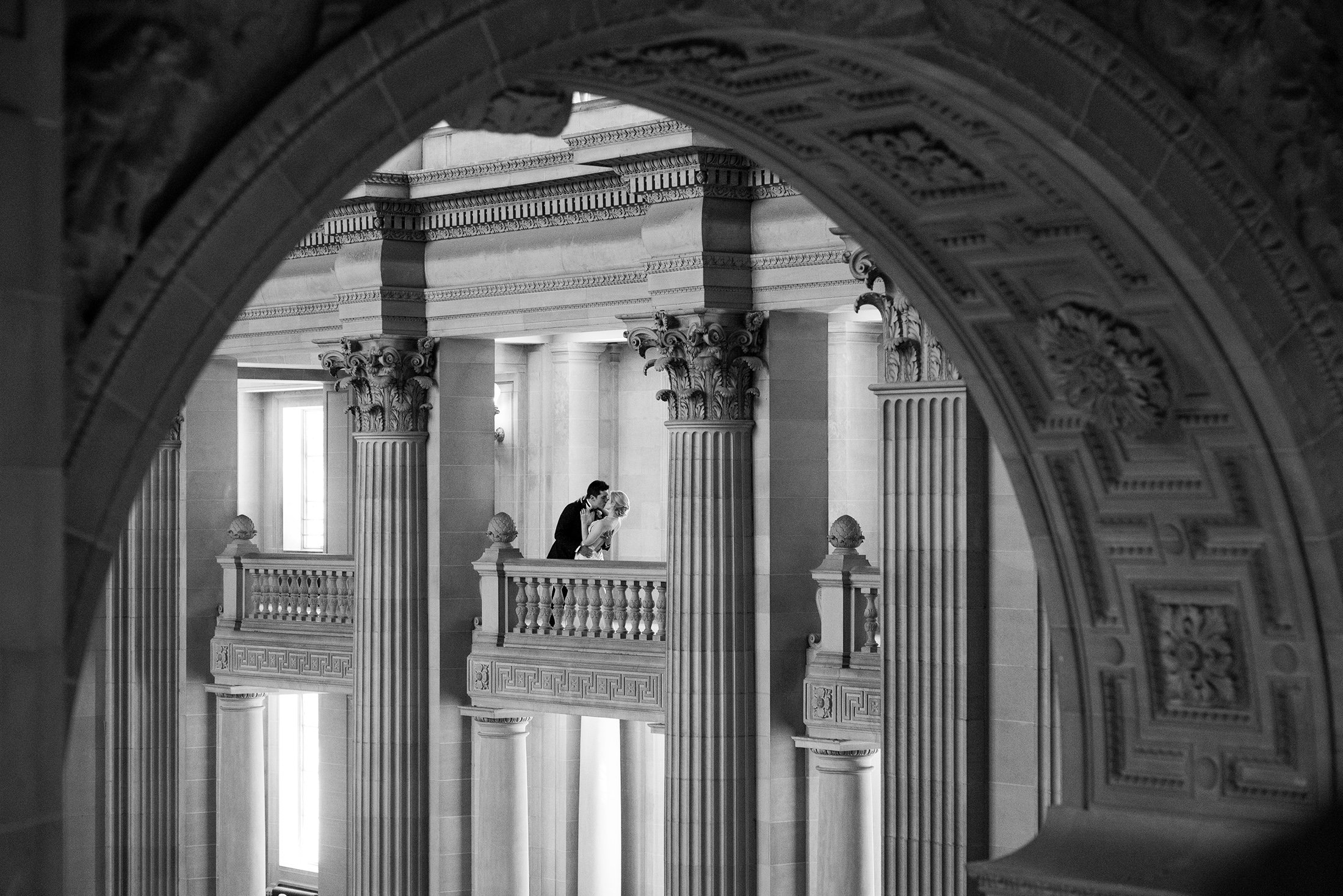  SF City Hall architecture frames a kissing couple 
