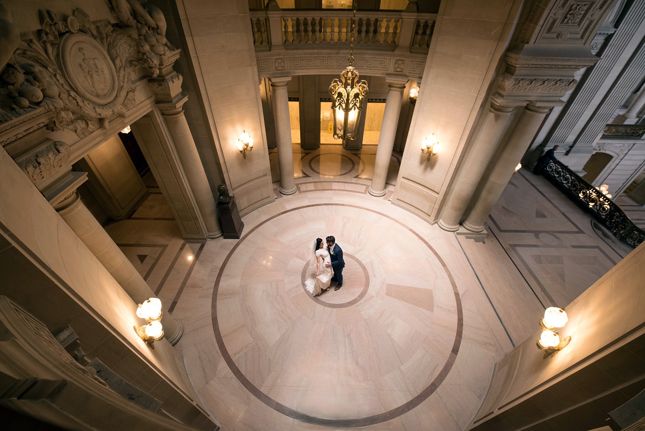  Bride and Groom dance in the rotunda at San Francisco City Hall on their wedding day. 