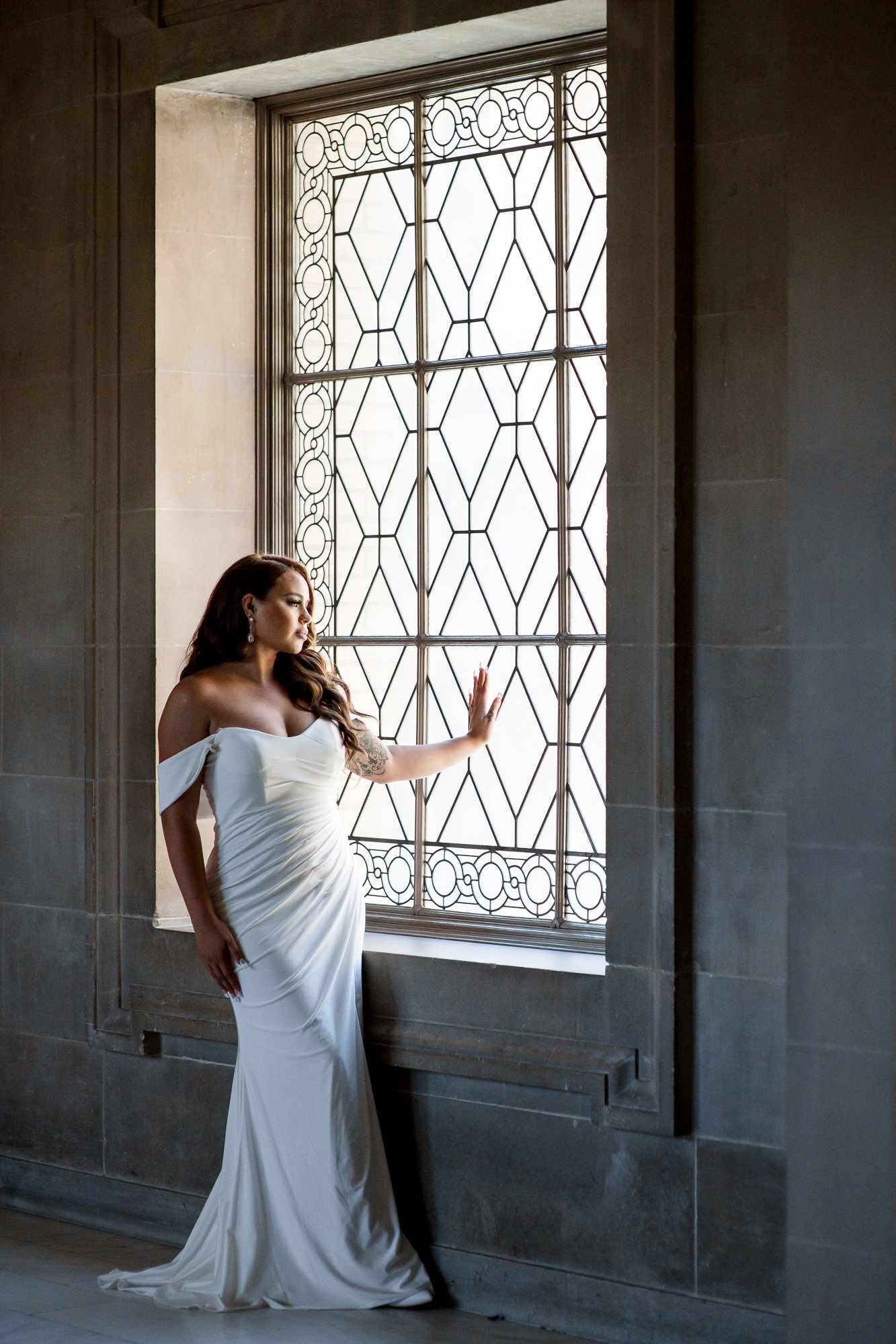  Beautiful bride at San Francisco City Hall looking out the window. 