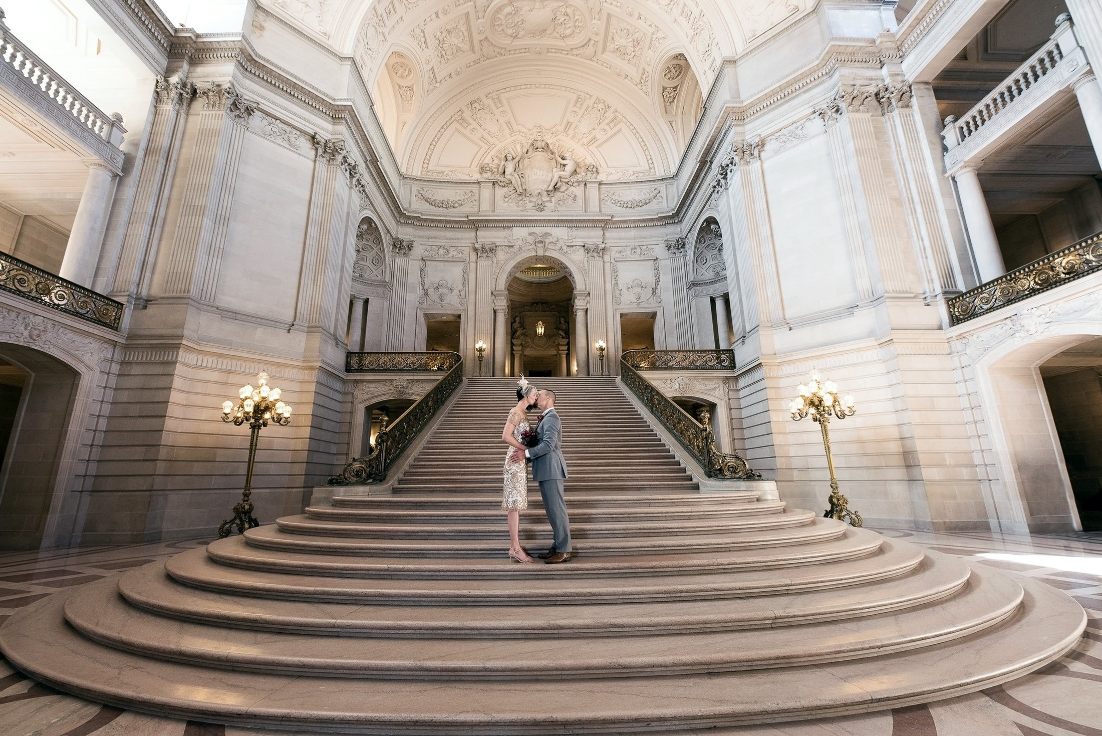 An intimate kiss on the staircase of SF City Hall