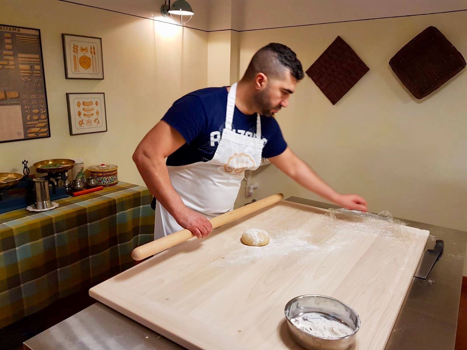 Re Di Roma’s Oualid Ferhati making pasta. Rome, 2018