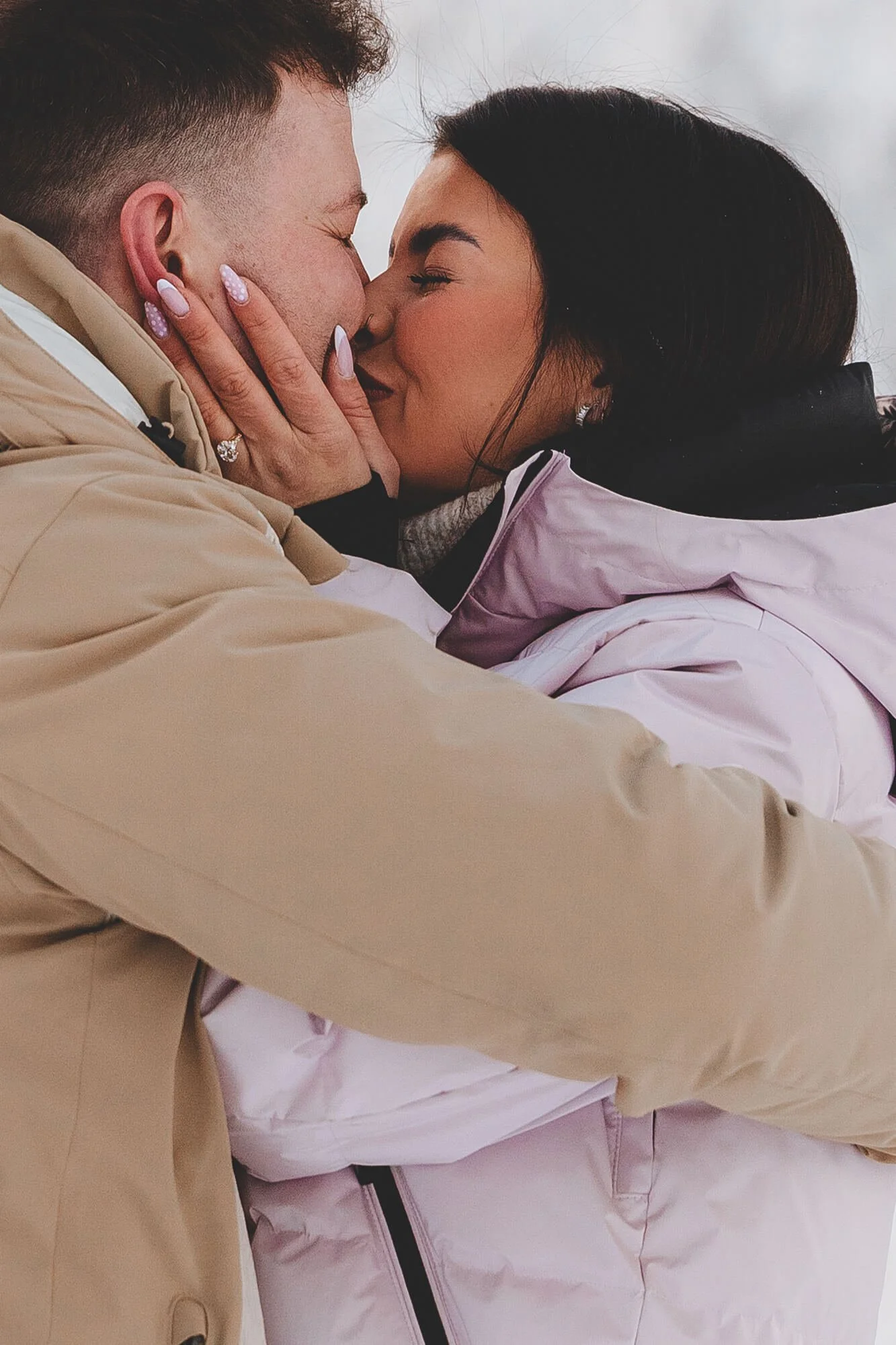 A man and a woman are close together, about to kiss, with their eyes closed. Wedding photographer Rovaniemi and Lapland. 