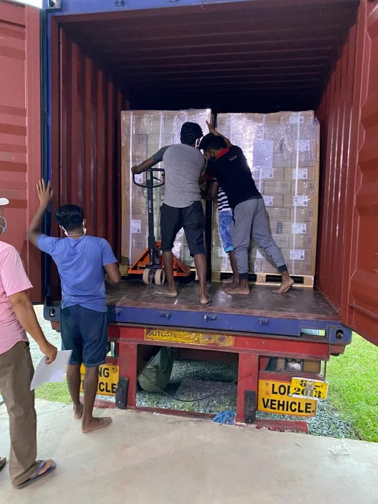 Workers with container.JPG