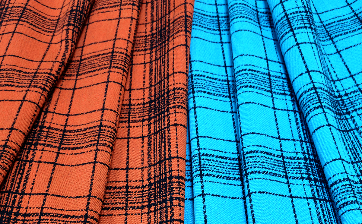 A large plaid, showing colours flame and teal
