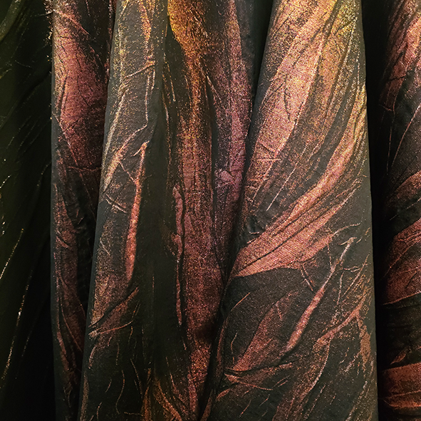 Frankie is a lurex cloque with a tree bark effect.