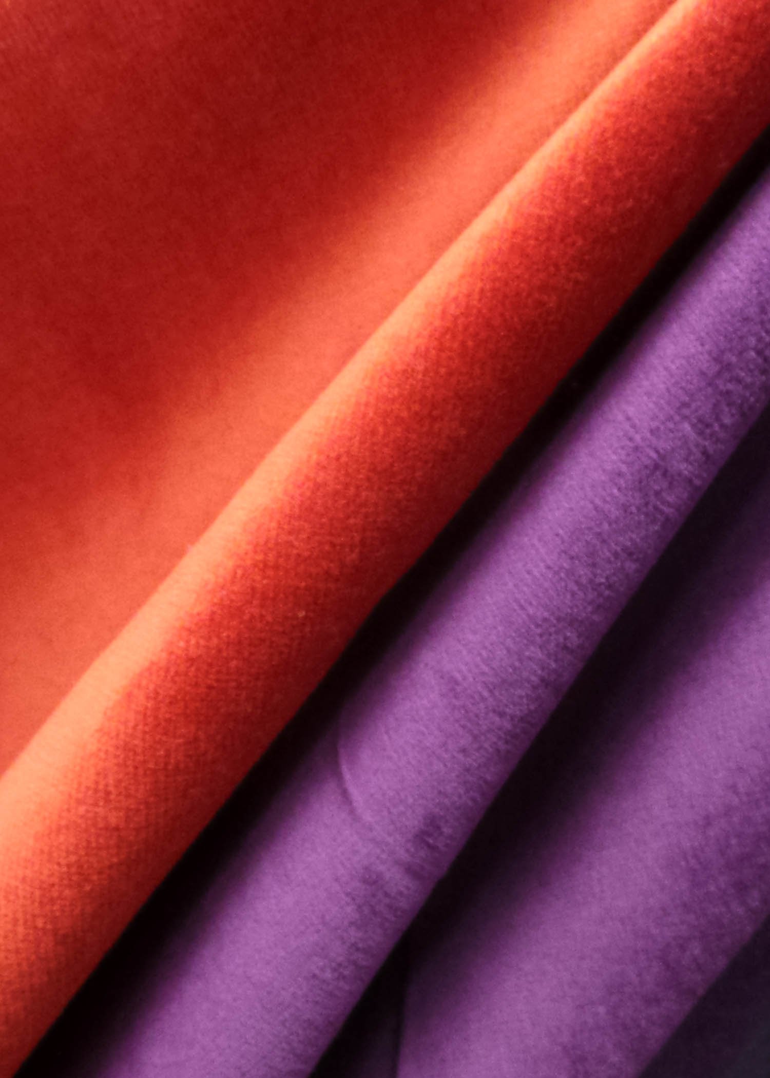 A short pile cotton poly velvet shown in red and purple