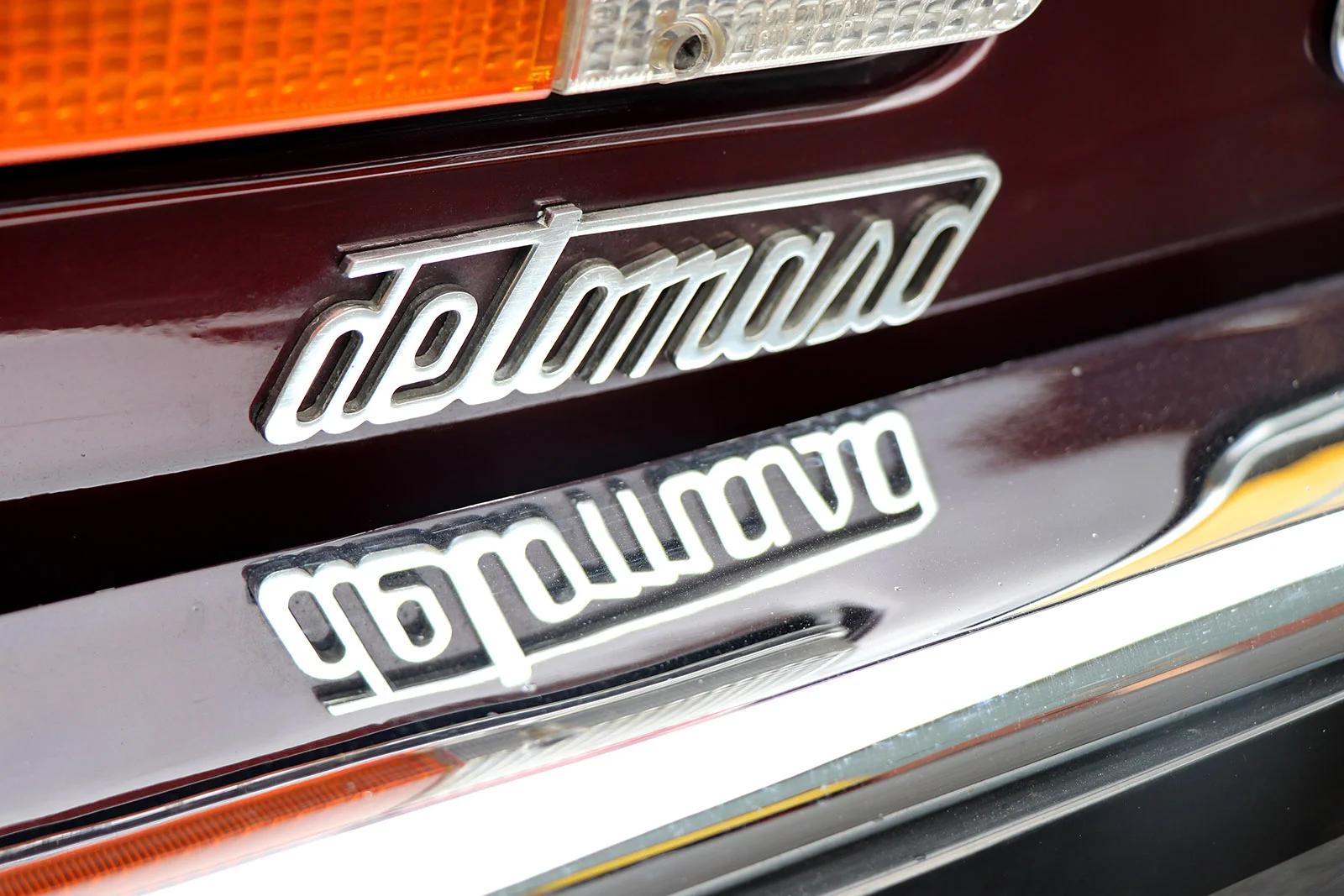 1982 series 2 burgundy deauville de tomaso badge web.jpg