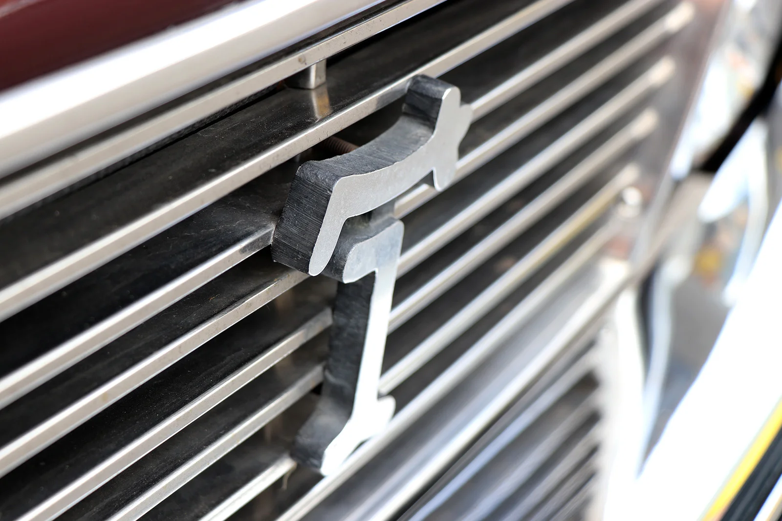 1982 series 2 burgundy deauville front de tomaso badge web.jpg