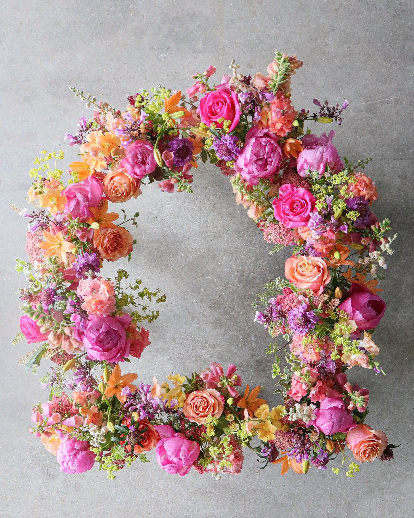 A floating, foam-free floral installation? Or a bunch of mason jars arranged on the concrete slab in the barn, where my grubby toes had to be cropped out of the shot? I'll never tell.