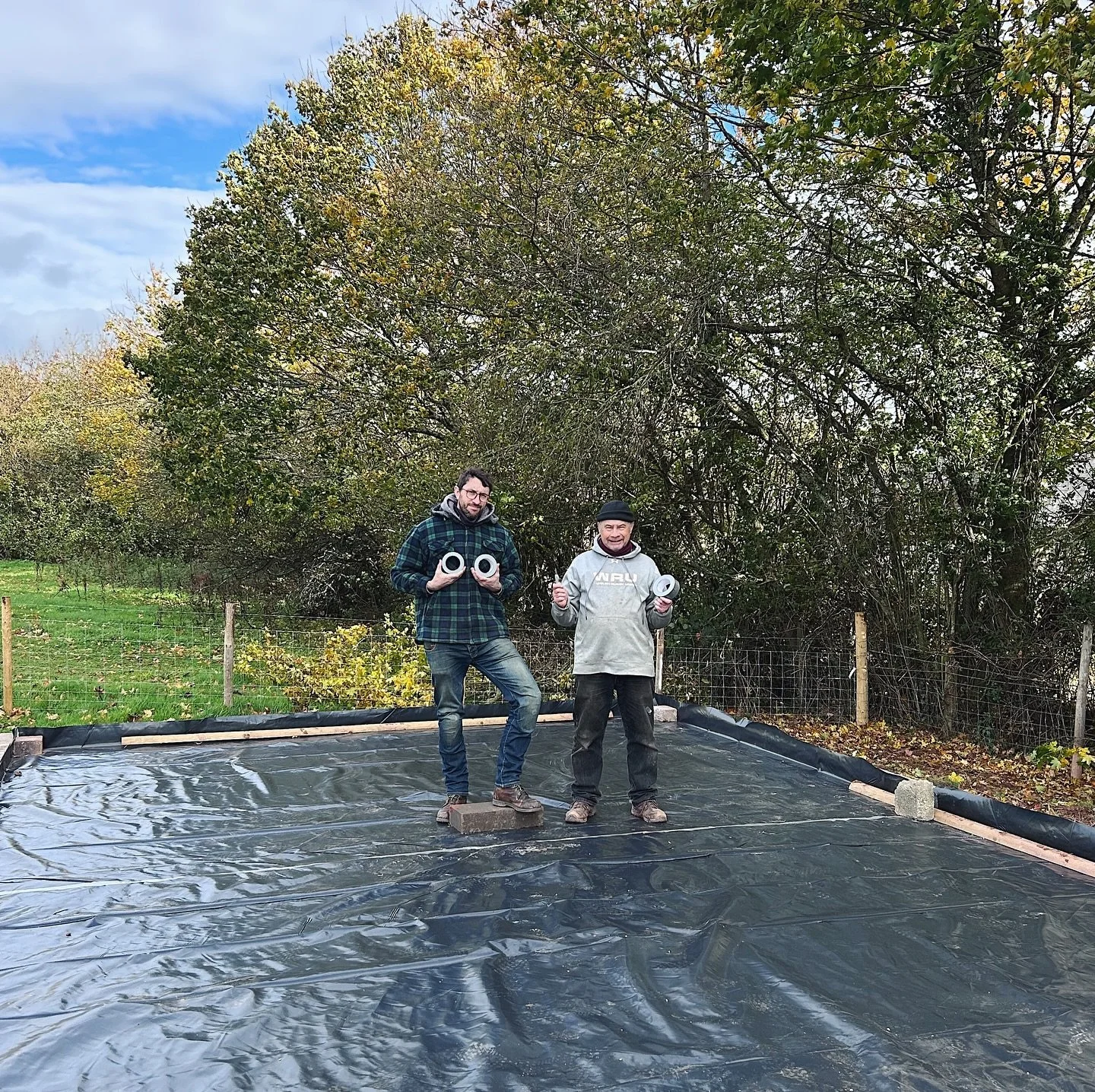After the block work came the tanking. Damp proof course and abundant duct tape, expertly laid by Brother Ffred and Father in Law Andy. This was a really satisfying step, transforming an amorphous whole with a wall into the solid foundation. It was v