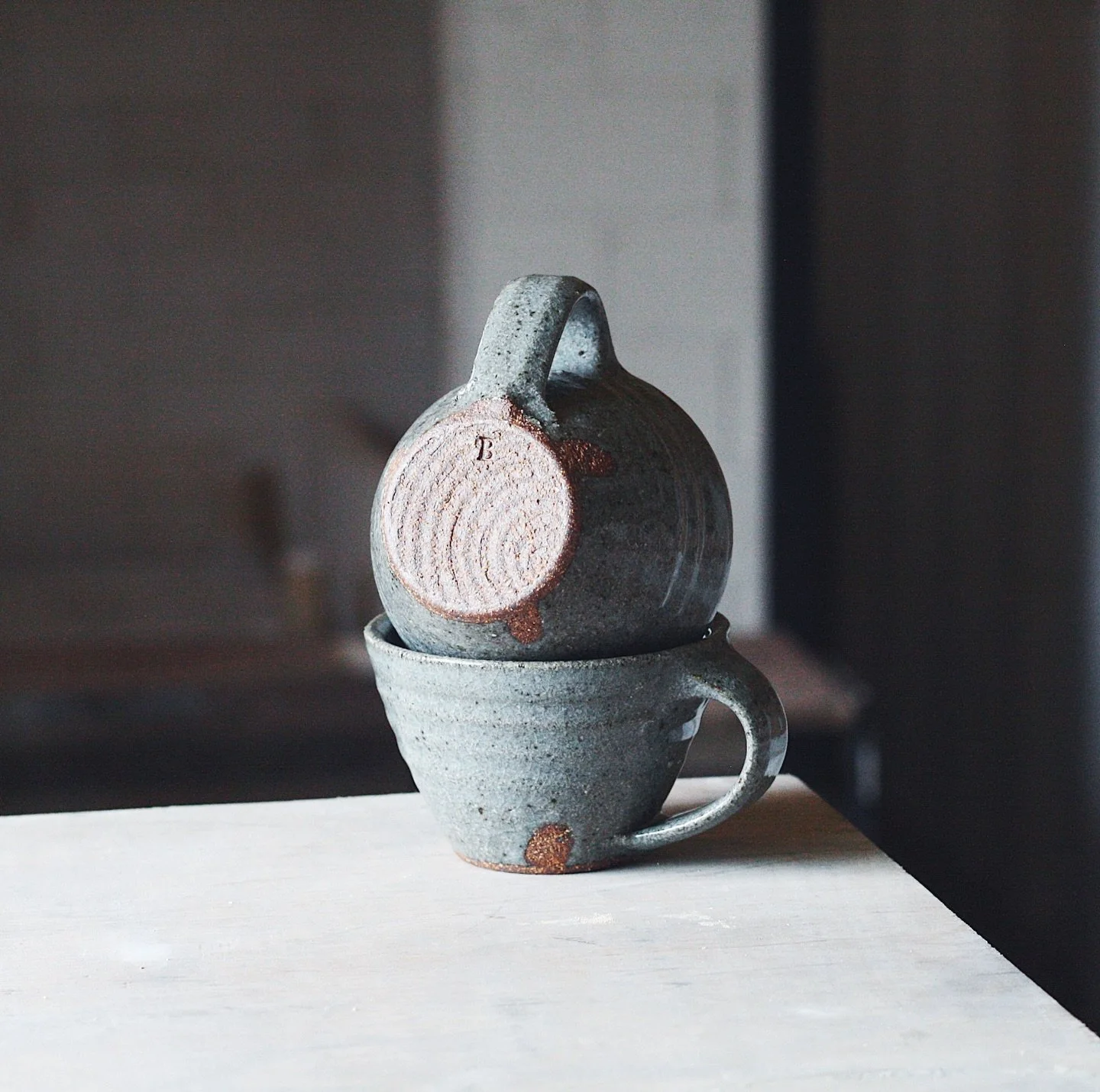 A new cup shape, or a revisited one I suppose. Definitely keeping one of these for my kitchen shelves, but the rest are coming to Potfest Compton Verney in a few weeks time. This version is raku clay and a simple clear glaze fired to around 1300 in t