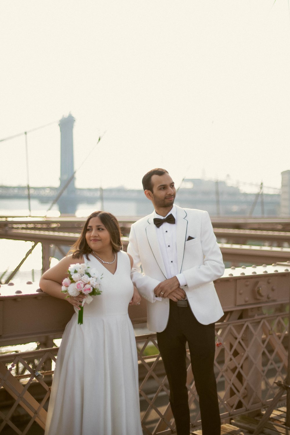 Celebrate love and togetherness with Misha and Sahil's intimate #NYCElopement, surrounded by the serenity of the #BrooklynBridge at dawn.