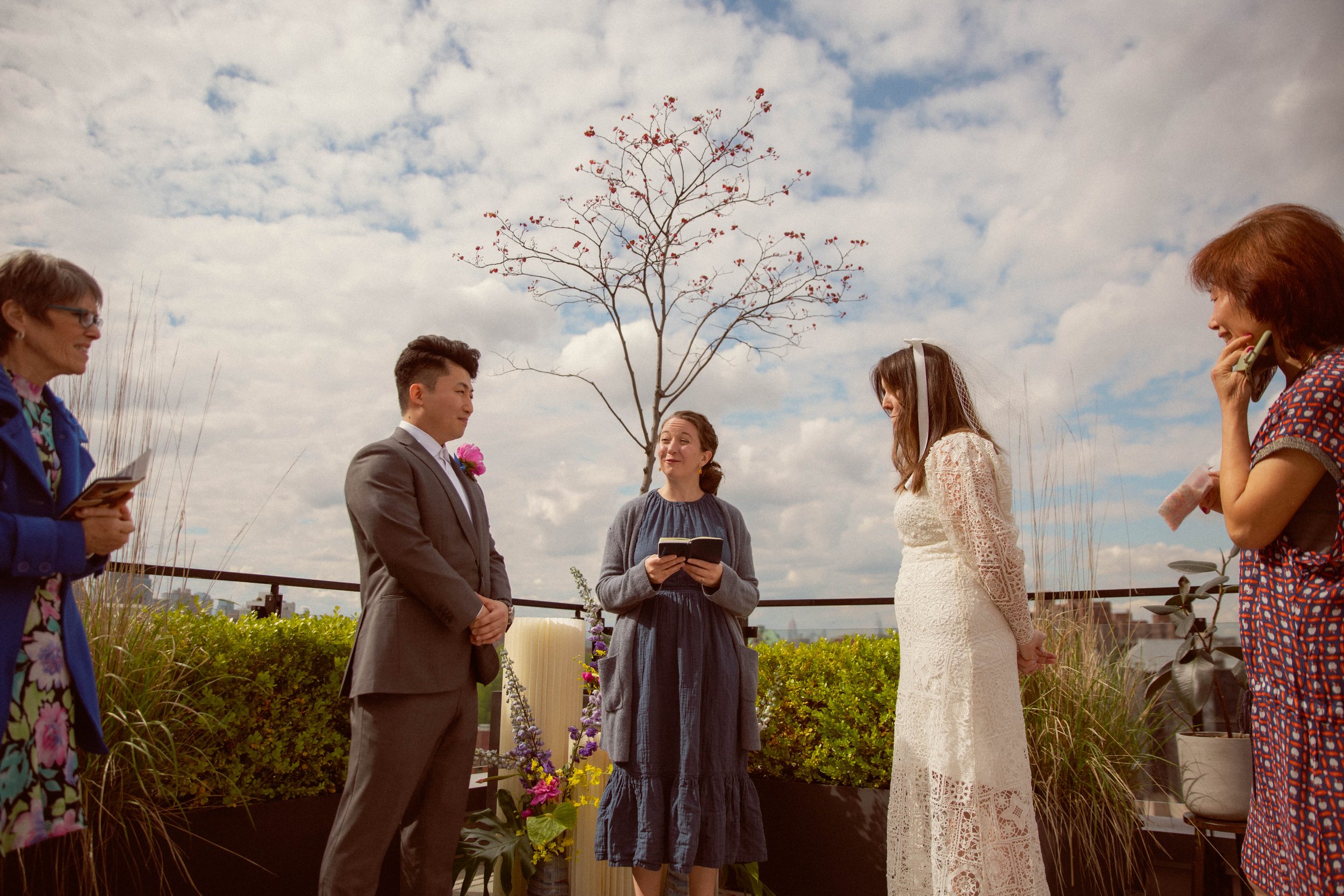 A photo exuding funky vintage vibes, featuring blurs and double exposure effects on a rooftop in the heart of Brooklyn. Capturing the couple's unique style and artistic vision.