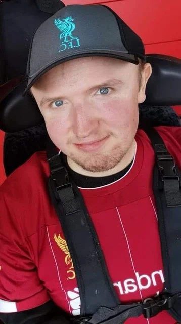 Young man with Muscular Dystrophy who is fundraising for a ‘robotic’ arm gets to trial a taste of independence at Champions League match