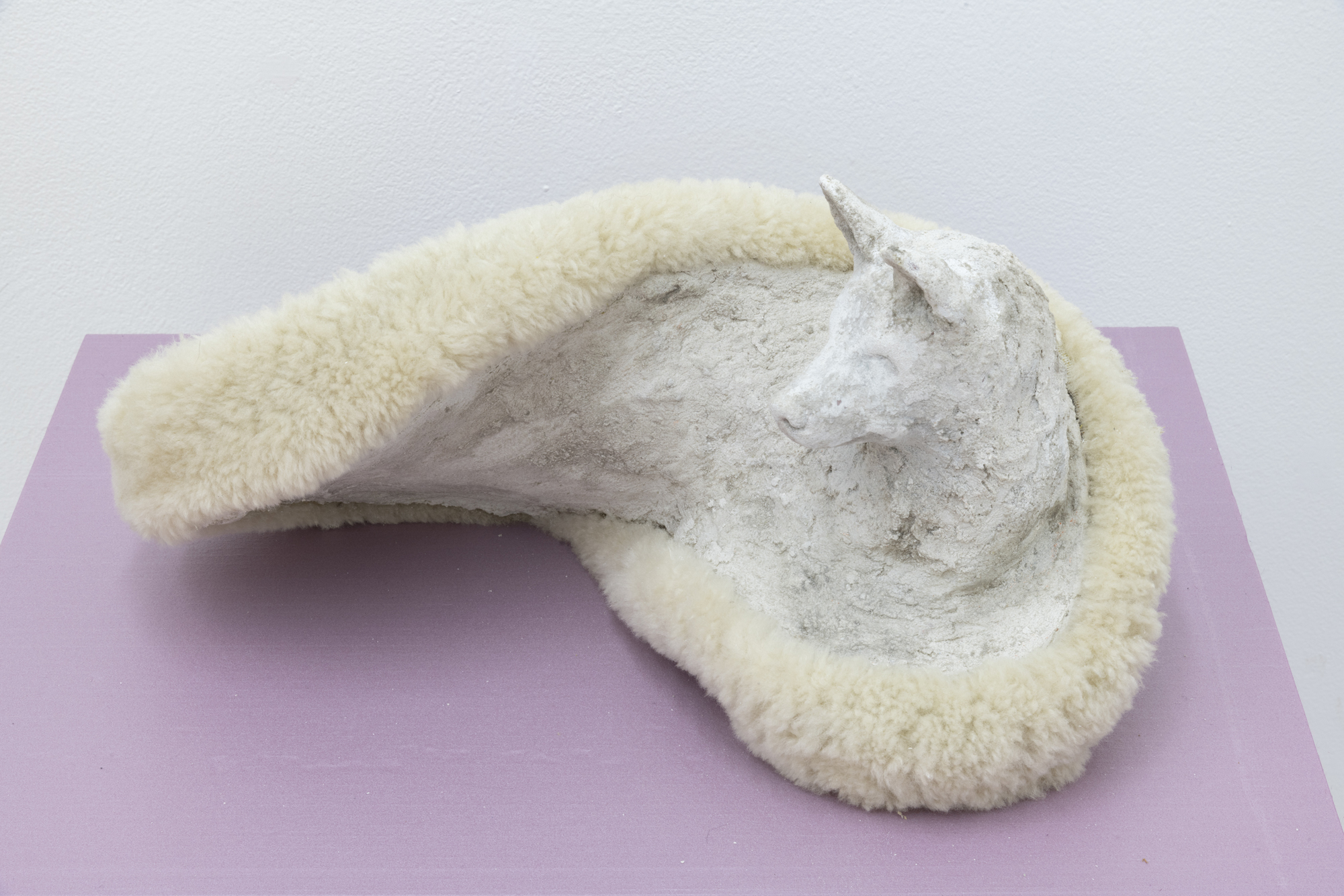   At Play,  2018. Concrete, epoxy resin, polyurethane foam, aluminum, and shearling steering wheel cover. 9.5 x 18 x 12 inches 