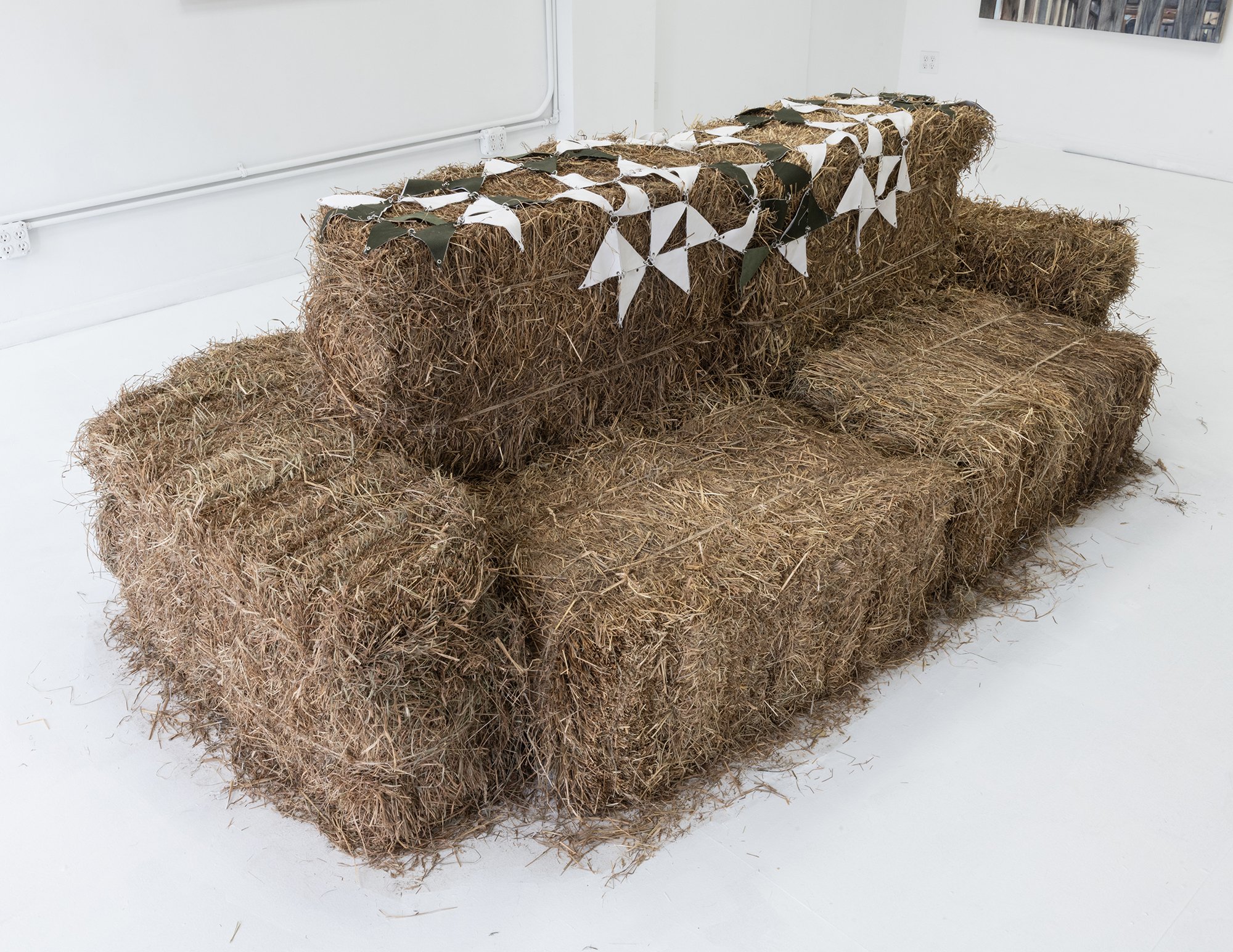  Sydney Shen,  Prop,  2022. Cotton, leather, aluminum, hay. 100 x 57 x 32 inches. 