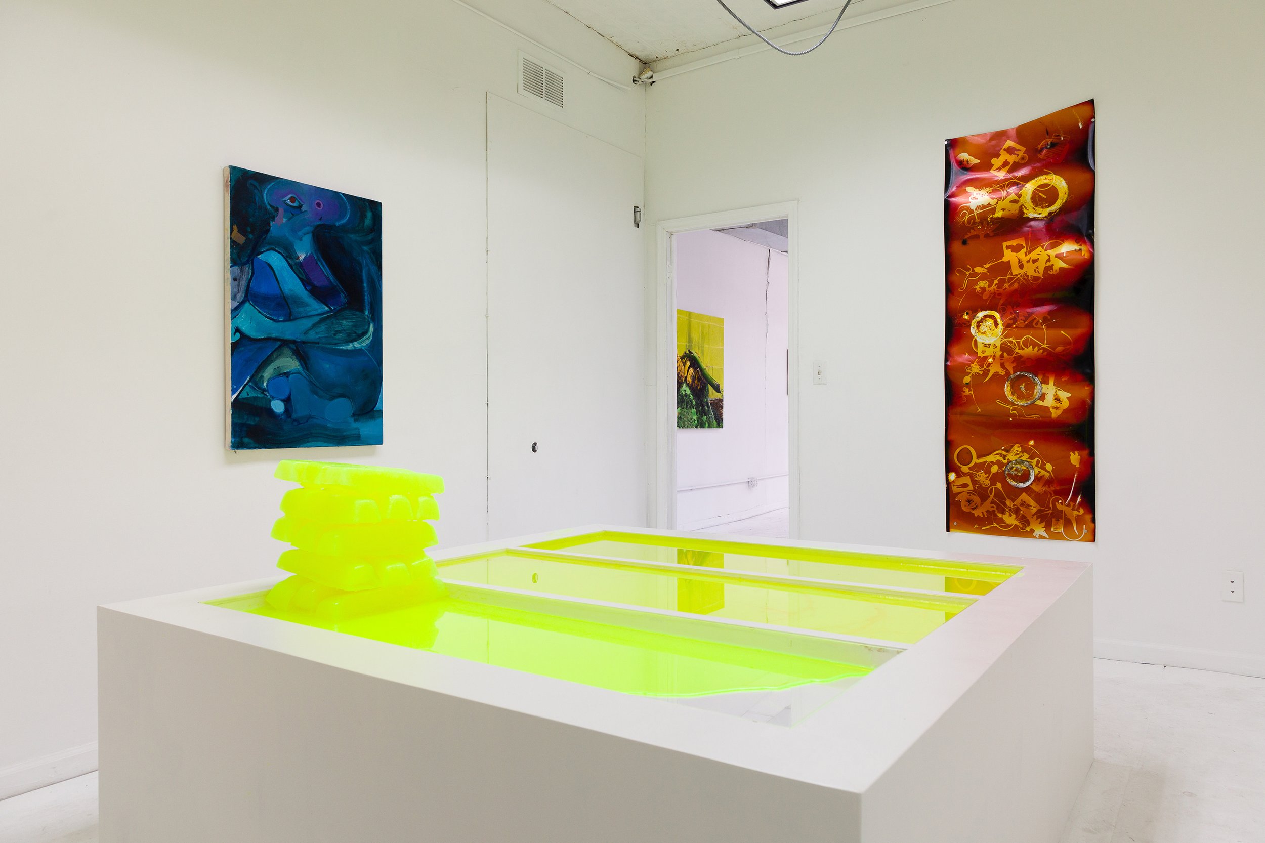  David Muenzer,  Highlighter Ingots  (interval 3 of 3) ,  2015–16. Highlighter ink, wood, latex paint, plexiglas. 22.25 x 71 x 74.25 in (melted). 