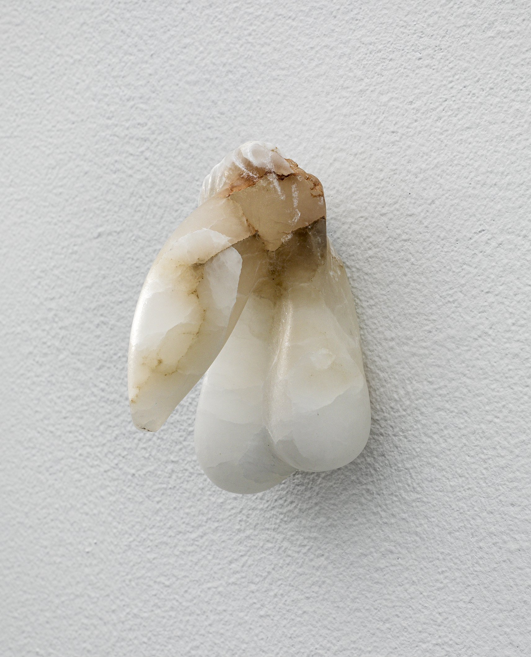  Covey Gong, Untitled, 2022. Alabaster with aluminum hanging mechanism. 3.75 x 2.25 x 3.25 inches. 