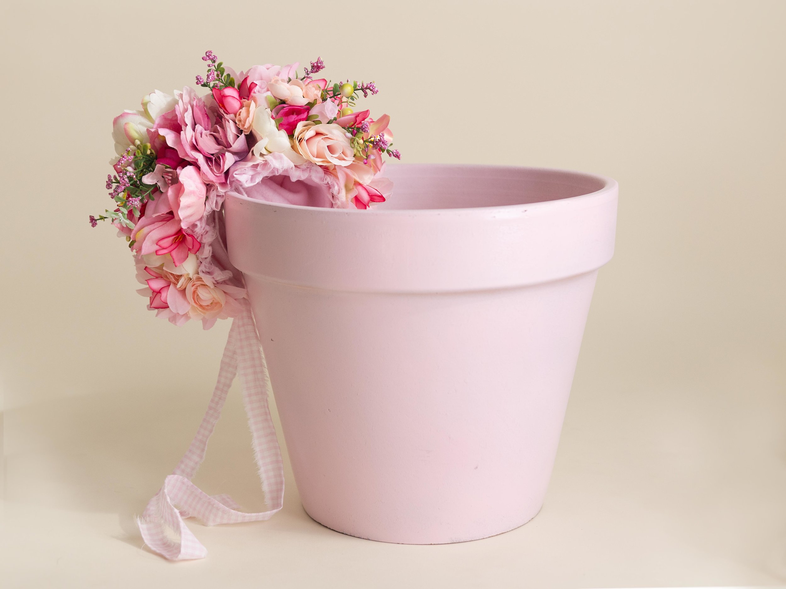  One of our most popular props for baby girls is this flower pot and flower bonnet.&nbsp; The girls look darling in the pot with the flower bonnet on.&nbsp; 
