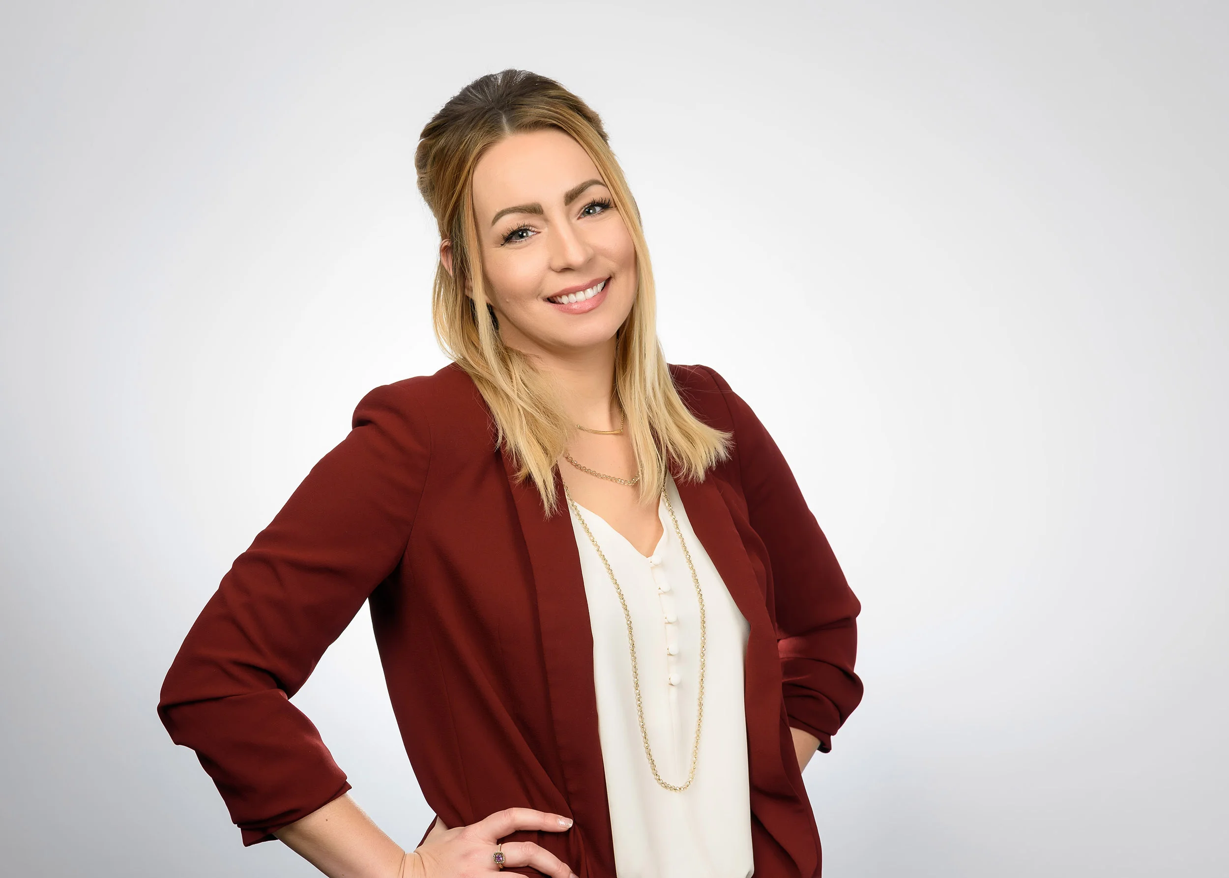 Jessica's company had me in for a headshot session, but also wanted a few photos with a more relaxed vibe, so I did some wider shots of each employee. The hand on her hip and the tilt of her head give this corporate portrait a friendly, casual feel.