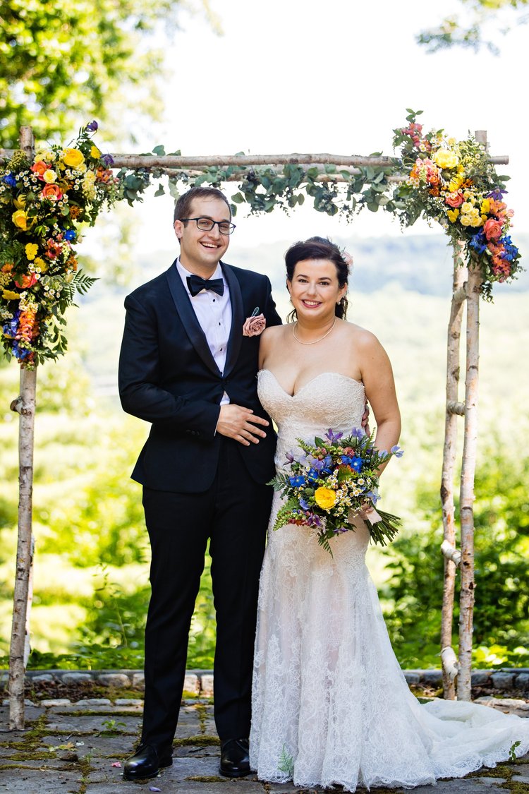 White birch wedding arch with flowers