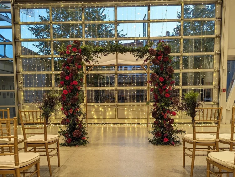 Contemporary copper chuppah with flowers